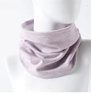 Detail of light purple ribbed knit neck warmer with logo and outdoor sport embroidery