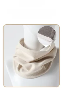 Detail view of the beige neck warmer featuring thick white plush lining and knitted fabric