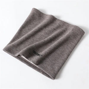 Detailed texture of grey-brown ribbed knit winter neck gaiter with soft fabric finish
