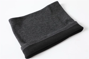 Detail of the dark grey knitted neck gaiter showing the warm black fleece lining inside
