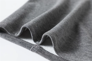 Close-up of grey ribbed knit neck gaiter with thick fleece lining and durable double stitching