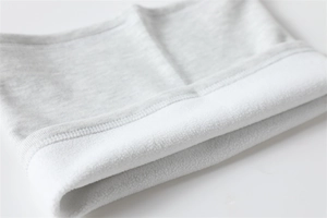 Close-up of knit neck warmer with soft white fleece lining and grey marl exterior