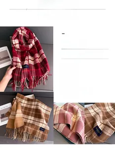 Detail of plaid scarves with tassels and classic woven labels in soft cashmere-like fabric