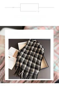 Detail shot of elegant plaid scarf with fringe in a gift box for autumn and winter