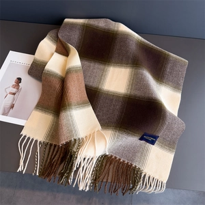 Close-up of contrast plaid scarf with elegant fringe detail and woven texture