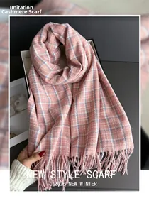 Close-up of pink plaid scarf with cashmere-like texture and soft fringe details