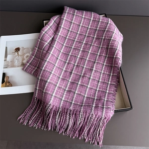 Detailed view of purple and white plaid scarf featuring elegant long tassel fringe accents