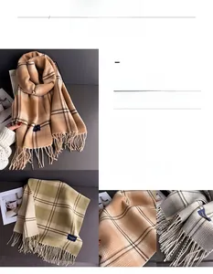 Detail shot of the soft plaid winter scarf fringe and cozy faux cashmere texture