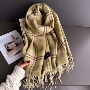 Soft green plaid cashmere scarf with long tassels and premium woven brand label