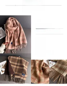 Close-up of pink and brown plaid scarf featuring soft knit texture and fringe detail