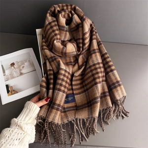 Elegant British plaid scarf with long tassels in warm brown and navy cashmere-like fabric