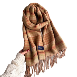 Classic plaid tassel scarf in orange and beige tones with Elegant Classic label tag