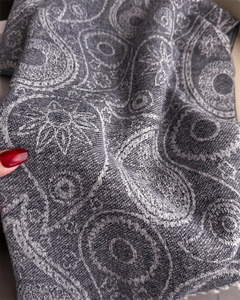 Detail shot of the thick paisley pattern fabric showing soft texture and weaving