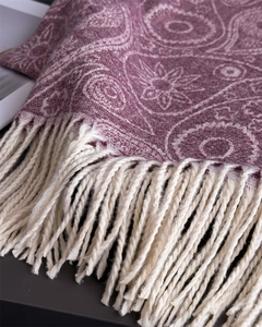 Detail of purple paisley pashmina shawl showing fine cashmere texture and white fringes