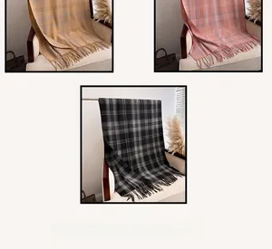 Detailed view of checkered scarves with tassels in ginger, pink, and monochrome colors