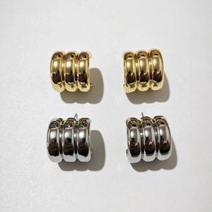 Minimalist geometric C-shape stacked hoop earrings set in polished gold and silver finish