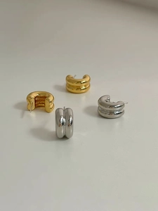 Minimalist double C-shaped hoop earrings in polished gold and silver finishes
