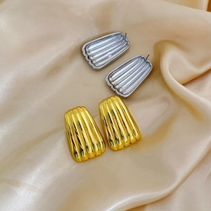 Textured geometric trapezoid hoop earrings in gold and silver finish with ribbed pattern