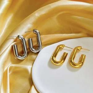 Chunky geometric U-shaped hoop earrings in polished 18K gold and silver finishes