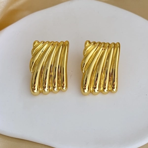 Detail of 18K gold-plated geometric square earrings with elegant vertical textured ripples