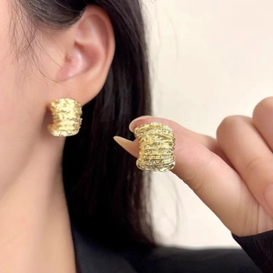 Fashionable C-shaped gold textured earrings with retro wrinkled metal design for women