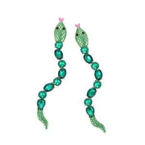 Detail of green enamel and crystal snake earrings with gold-tone curved snake drop