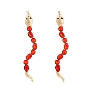 Golden snake drop earrings with sparkling red crystals in a curved designer style