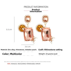 Detail view of pink crystal earrings with size dimensions 5.5cm by 3.6cm and weight specs