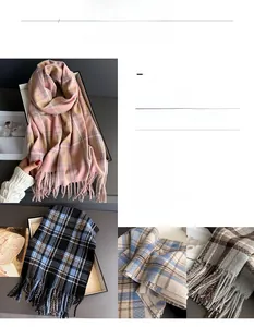 Close-up of thick plaid scarf featuring long fringe details and soft cashmere-like texture