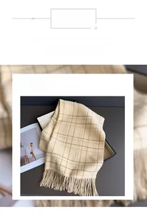 Close-up of soft plaid scarf with fringe in a gift box showing smooth material texture