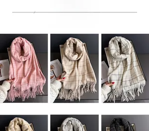 Detailed color selection display of various plaid tassel scarves in soft cashmere-like fabric