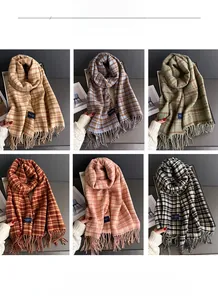 Detail display of six classic plaid scarves with long tassels and soft knit texture