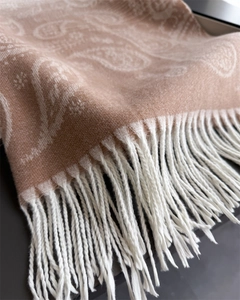 Close-up of soft paisley cashmere-feel scarf with elegant white fringe details