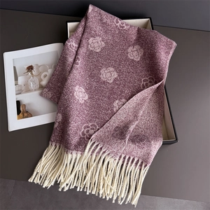 Detail of camellia pattern jacquard scarf with tassels on premium black gift box