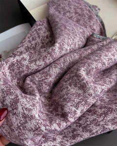 Macro shot of purple and grey cashmere-like scarf showing fine jacquard texture and thick weave