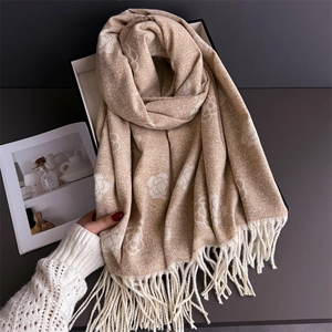 Beige camellia jacquard scarf with long tassels made of thick cashmere-like warm fabric