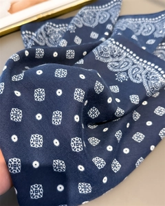 Close-up of navy blue paisley cotton-linen scarf showing herringbone texture and print