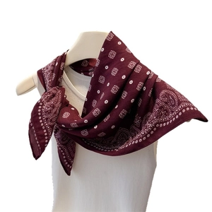 Retro wine red paisley pattern square cotton neck scarf for women tied on a model