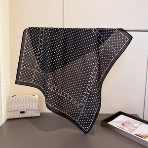 Elegant polka dot and geometric pattern neck scarf in black and white silk-like fabric