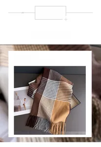 Detail showing the soft plaid polyester fabric texture and fine fringe of the scarf