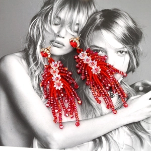 Bohemian oversized red beaded tassel earrings with crystal flowers on fashion magazine