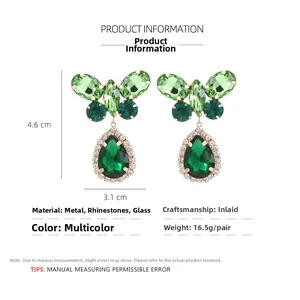 Detailed view of green crystal butterfly drop earrings with size 4.6cm by 3.1cm