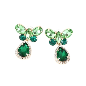 Elegant gold butterfly earrings with green crystals and teardrop pendants on white background
