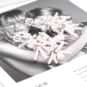 Bohemian pearl flower tassel earrings with long fringe and white petals for women