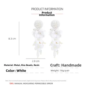 Detail showing white beaded floral tassel earrings with size dimensions and specifications