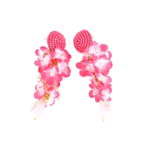 Pink and white fabric flower tassel earrings with handmade beadwork on white background