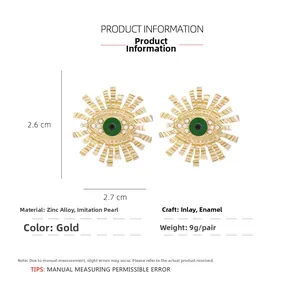Detailed size chart of gold enamel evil eye earrings with white pearls and green resin