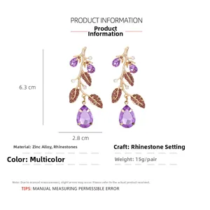 Detail view of crystal branch earrings with dimensions 6.3x2.8cm and 15g weight spec