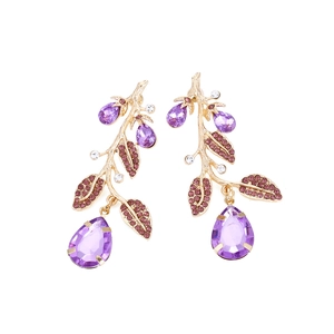 Exquisite gold leaf branch earrings featuring purple gemstones and vibrant crystal accents