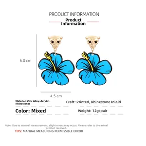 Detail of leopard head earrings with blue acrylic flowers, size 6x4.5cm and 12g weight
